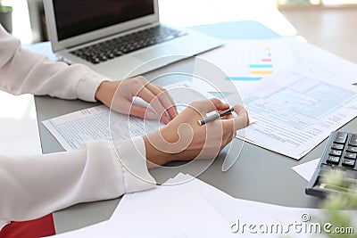 Tax accountant working with documents Stock Photo