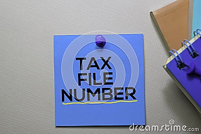 Tax File Number text on sticky notes isolated on office desk Stock Photo