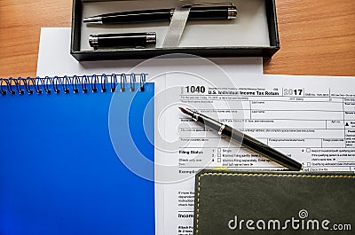 1040 tax form, notebooks and pens Editorial Stock Photo