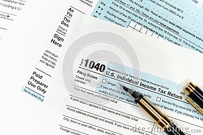 1040 Tax Form. Filing Taxes Document on Table in Office Editorial Stock Photo