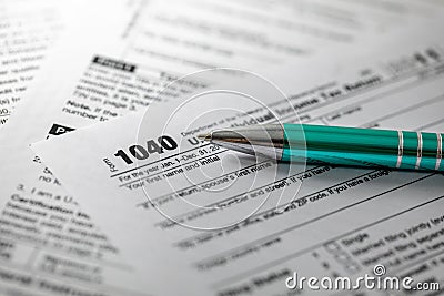 tax form 1040 and pen Editorial Stock Photo