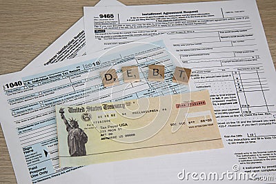 Tax Forms to File Income Tax with fake check Editorial Stock Photo