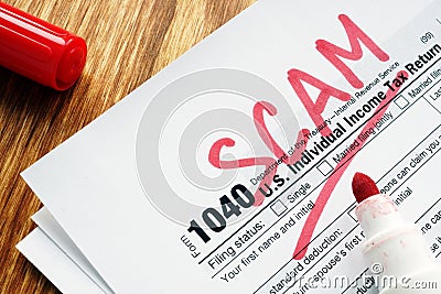 Tax scam. Form with sign on a desk Editorial Stock Photo