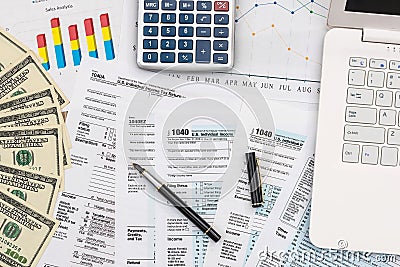 Taxation concept, business graphs with dollar banknotes Editorial Stock Photo