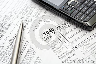 Taxes and forms, mobile phone and pen Editorial Stock Photo