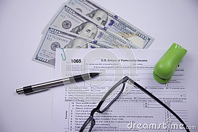 U.S. Partnership Income Tax Form 1065 with American Currency Stock Photo