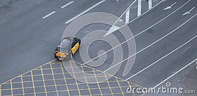 Taxi cab crossing empty lanes in Barcelona Editorial Stock Photo