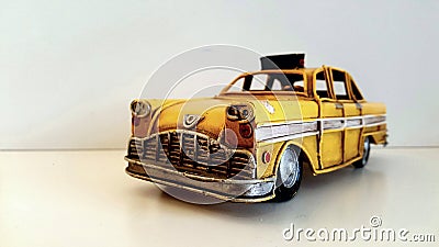 Taxi car. Vintage yellow and iron pattern model. Stock Photo