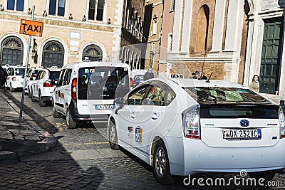 Taxi stand with many white taxis in Rome, Italy Editorial Stock Photo