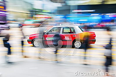 Taxi on the streets of Hong Kong with motion blur Editorial Stock Photo