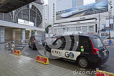 Taxi waiting in line outside Tokyo Metro Shinagawa Station Editorial Stock Photo