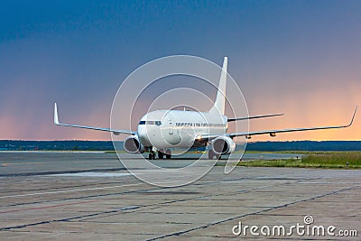 Taxiing aircraft early in the morning on the main taxiway Stock Photo