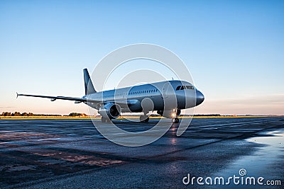 Taxiing passenger airplane at the airport apron Stock Photo