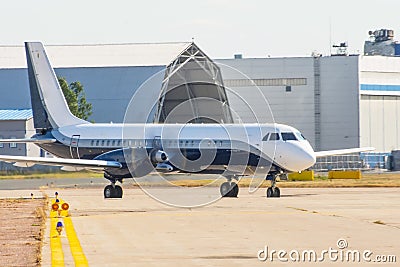 Taxiing of a passenger turboprop aircraft after landing Stock Photo