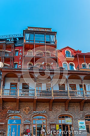 Tbilisi, Georgia, 17 December 2019 - multi level building of old town houses with carved balconies Editorial Stock Photo