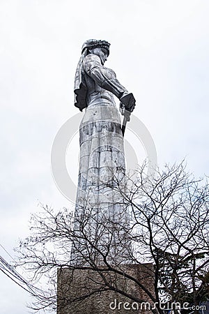 TBILISI, GEORGIA - January 08, 2023: Statue Mother of Georgia with tree in foreground the famous symbol of Tbilisi Editorial Stock Photo