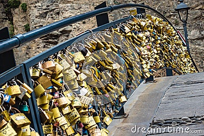 Tbilisi, Georgia - November 2, 2018: Gold color locks on the bridge of love Editorial Stock Photo