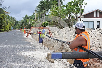 Te Aponga Uira workers lay underground cable in Rarotonga Cook I Editorial Stock Photo