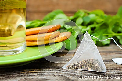 Tea bag? mint, cookie and cup of tea Stock Photo