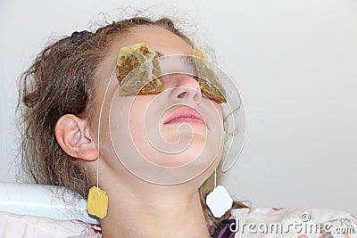 Tea bag for tired eyes Stock Photo