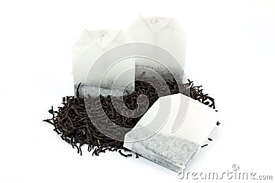 Tea bags and dried tea leaves Stock Photo