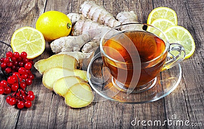 Tea for cold and flu. Lemon, ginger, kiwi fruit, and viburnum for tea for a cold. Stock Photo