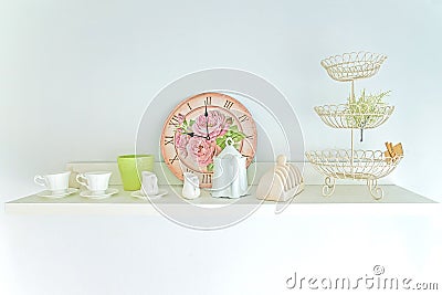 Tea Cup ,clock and decorate vintage in shelf Stock Photo