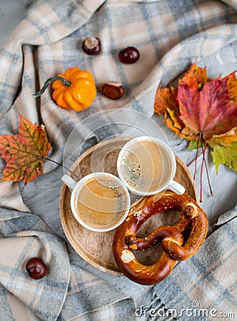 Tea Cup with Coffee Hot Chocolate Autumn Time Bakery Pretzel Toned Photo Knitting Scarf Blanket Stock Photo