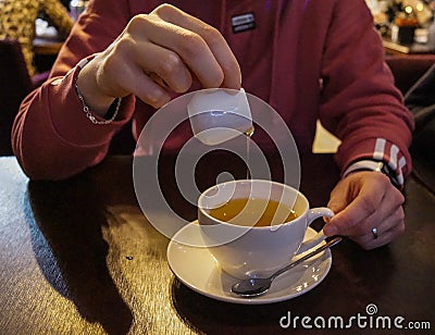 the tea cup, filled with a fragrant brew Stock Photo