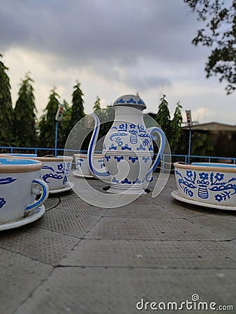 Tea cups, saucers and kettles Stock Photo