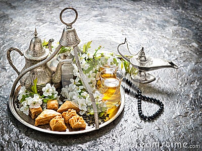 Tea glasses and pot, oriental traditional delight baklava. Vintage style Stock Photo