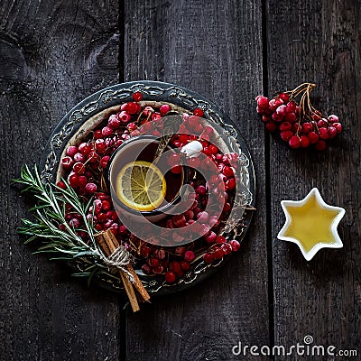 Tea with a guelder-rose and a lemon Stock Photo