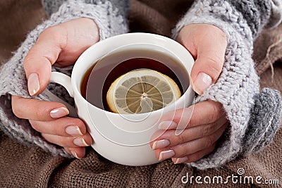 Tea with lemon on a cold day Stock Photo