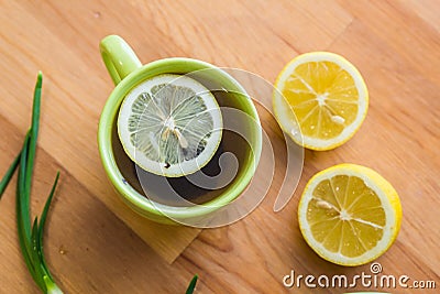 Tea with lemon and croissant for fresh spring breakfast Stock Photo