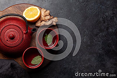 Tea with lemon and mint and teapot Stock Photo