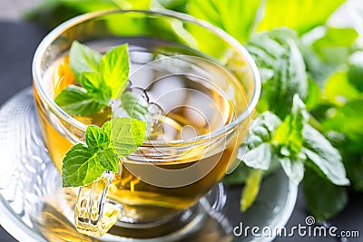 Tea. Mint Tea. Herbal tea. Mint leaf. Mint leaves. Tea in a glass cup, mint leaves, dried tea, sliced lime. herbs tea and mint lea Stock Photo