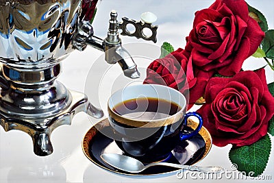 Tea party - samovar, Cup, flowers garden roses summer day. Samovar â€” creative metal for tea, Russian traditions, represents well Stock Photo