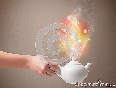 Tea pot with abstract steam and colorful lights Stock Photo