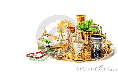 Tea service green mint Ramadan decoration lantern vibrant Stock Photo