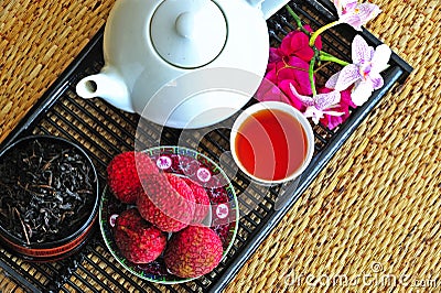 Tea set with chinese tea and litchees Stock Photo