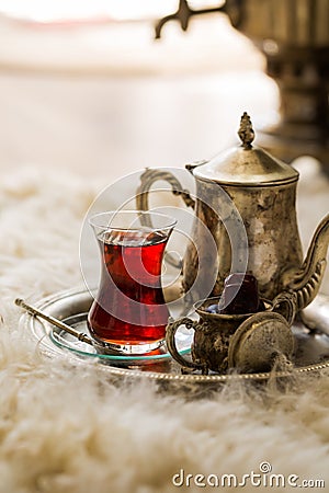 Tea set in oriental style in pear shaped glass with vintage kettle and dates fruit Stock Photo