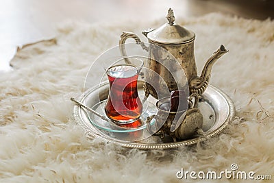 Tea set in oriental style in pear shaped glass with vintage kettle and dates fruit Stock Photo