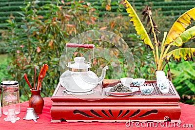 Tea set on a wooden plate Stock Photo