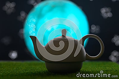 Tea time, oriental tales, teapot with oriental background, starry sky and moon. Delicious and spicy tea Stock Photo