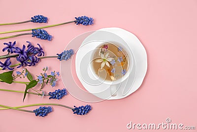 Tea Time: Relaxing with herbal tea with healing properties. Drink with natural herbs. Floral tea arrangement Stock Photo