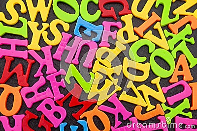 Teach the alphabet and educate conceptual idea with a big mess of different colour letters in word jumble Stock Photo