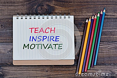 Teach Inspire Motivate on notebook Stock Photo