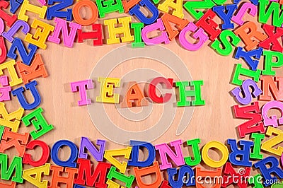 Teach written by plastic colorful letters Stock Photo