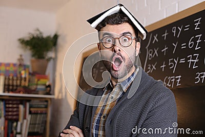 Teacher absorbing information from book using telepathy Stock Photo