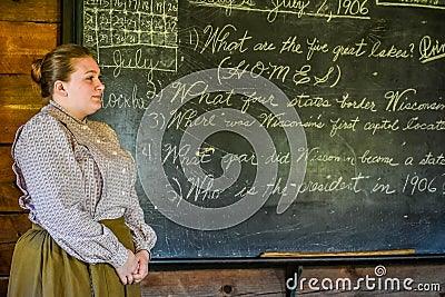 Teacher with Chalkboard, Cursive Handwriting Editorial Stock Photo